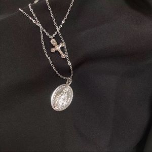 Silver cross and virgin necklace